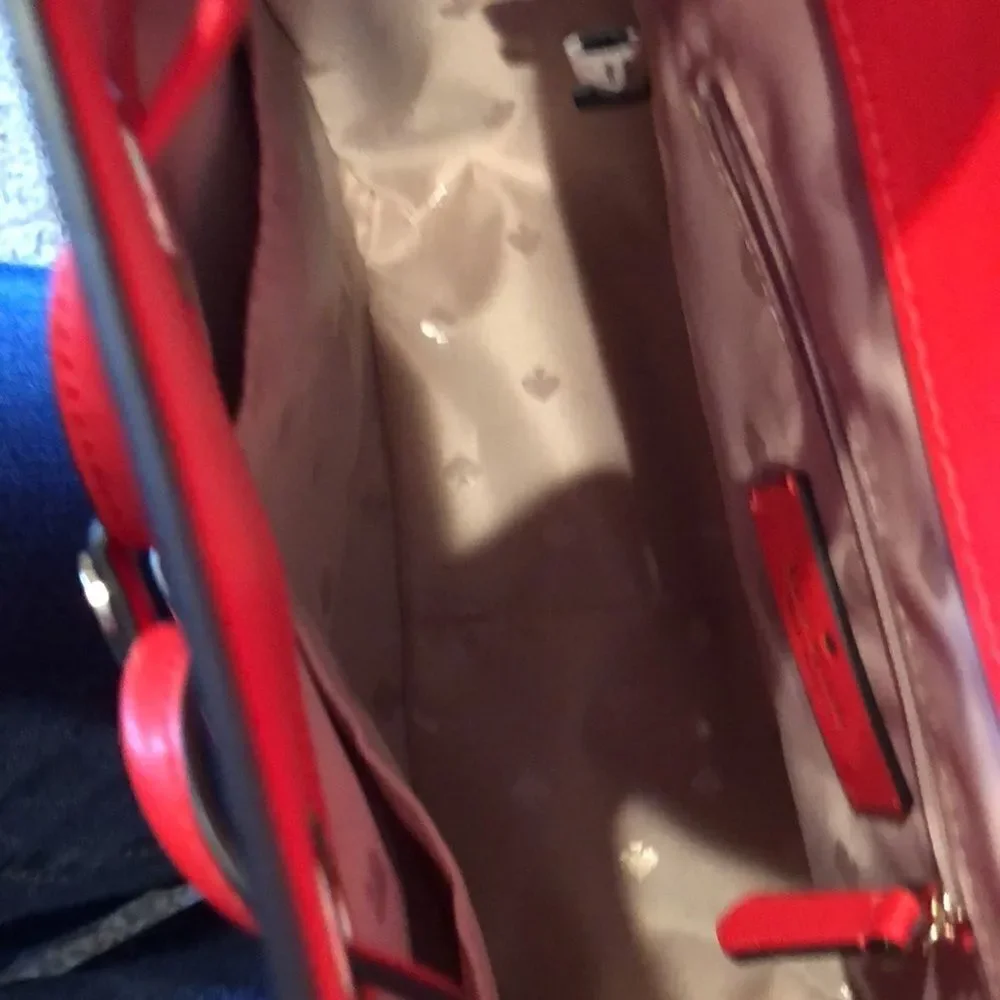 Kate Spade Lizzie medium red backpack.